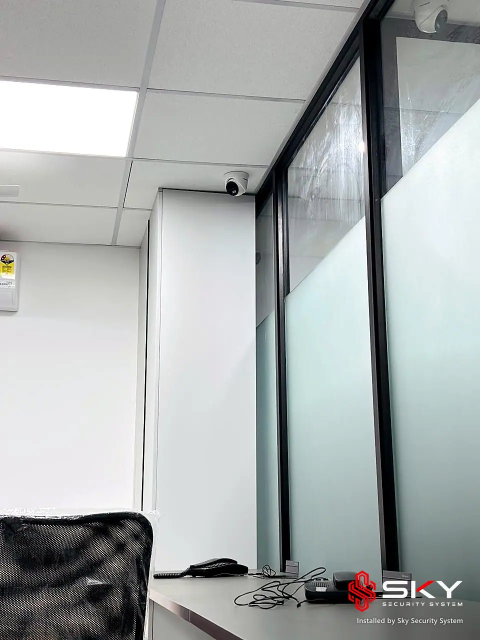 Ceiling dome camera at a corporate office. Security and ELV work by Sky Security System.