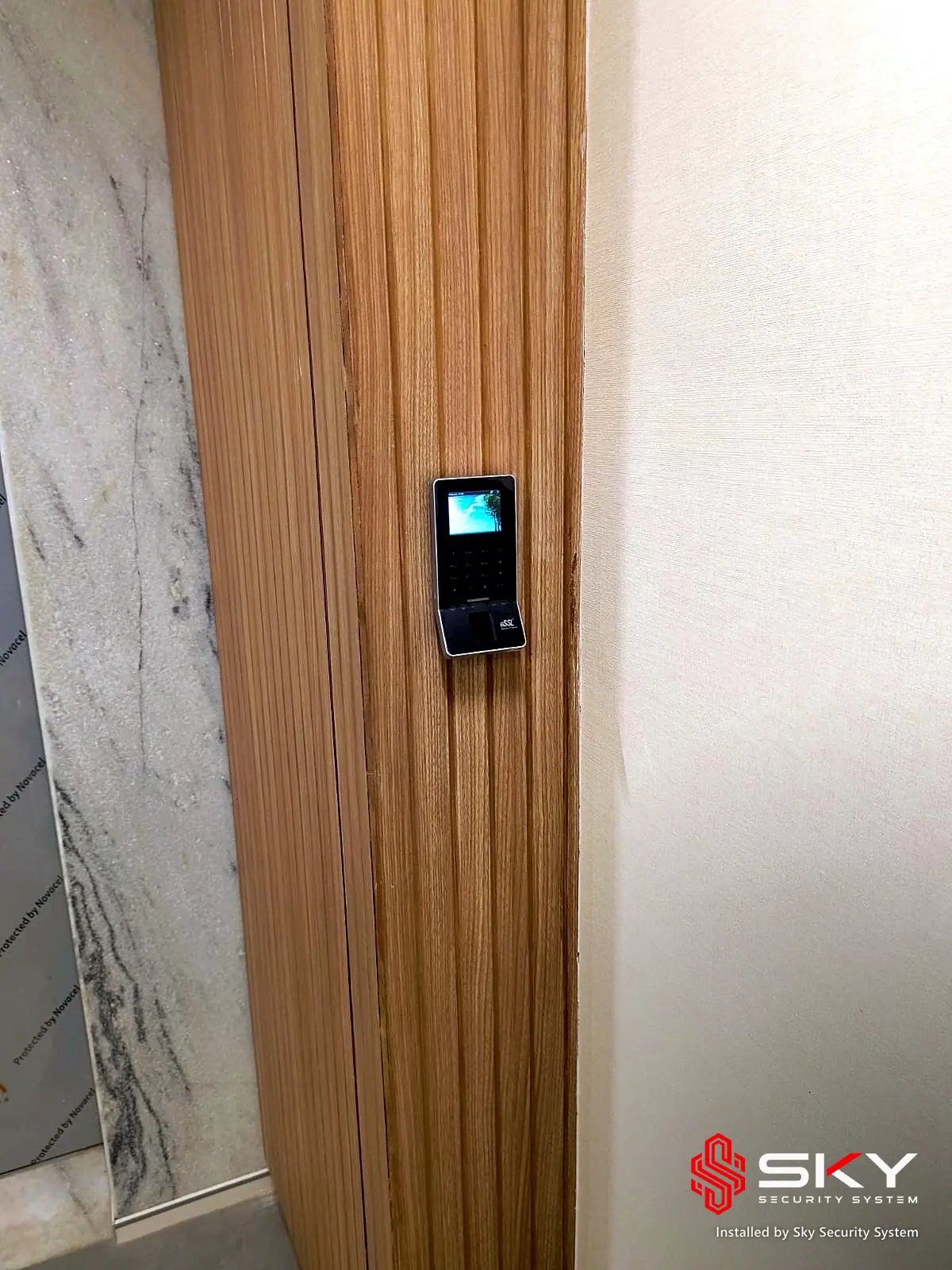 Biometric access control reader at a corporate office, Andheri, Mumbai. Security and ELV work by Sky Security System.
