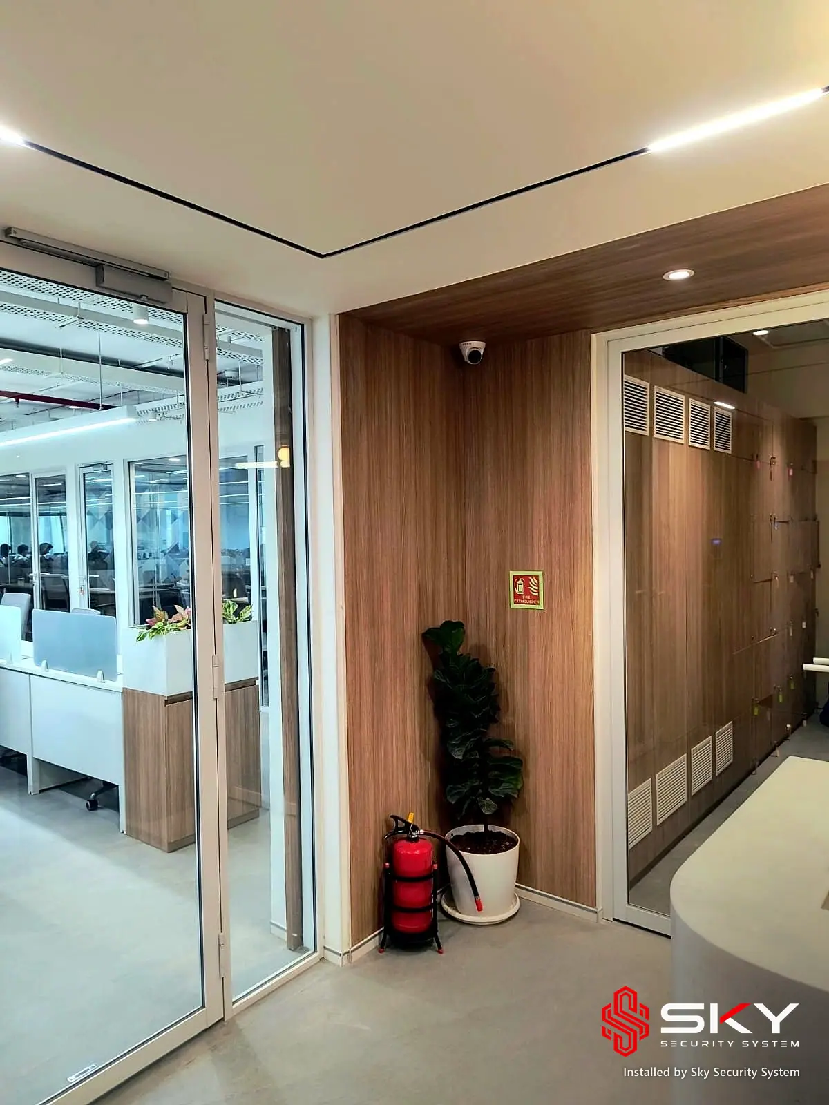 Glass partition with a dome camera at a corporate office, Andheri, Mumbai. Security and ELV work by Sky Security System.