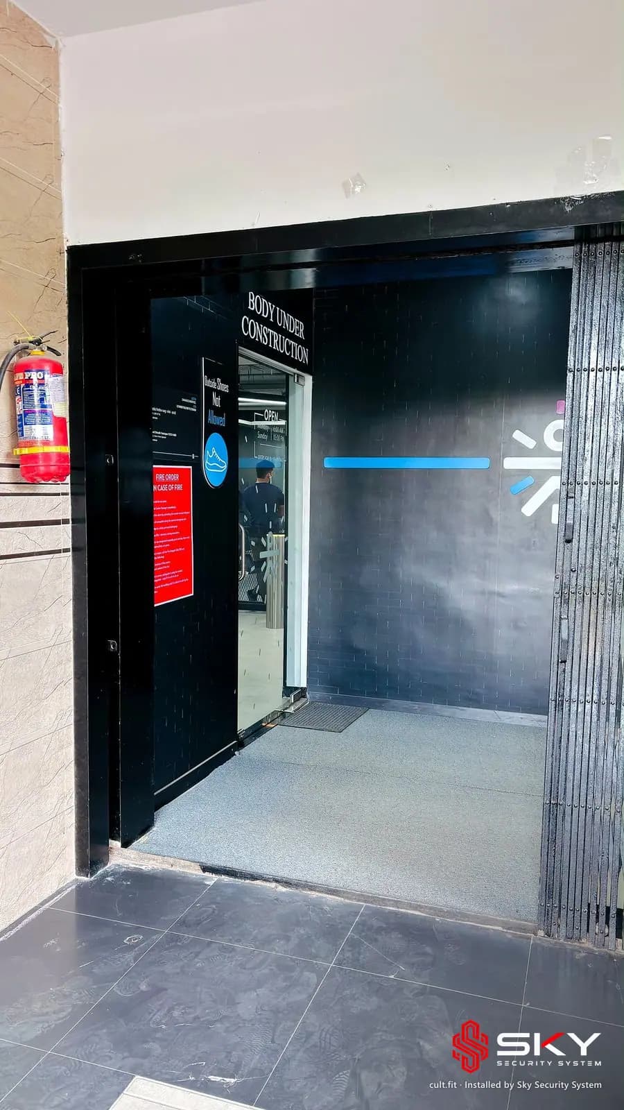 Gym entrance at the cult.fit site. Security and ELV work by Sky Security System.