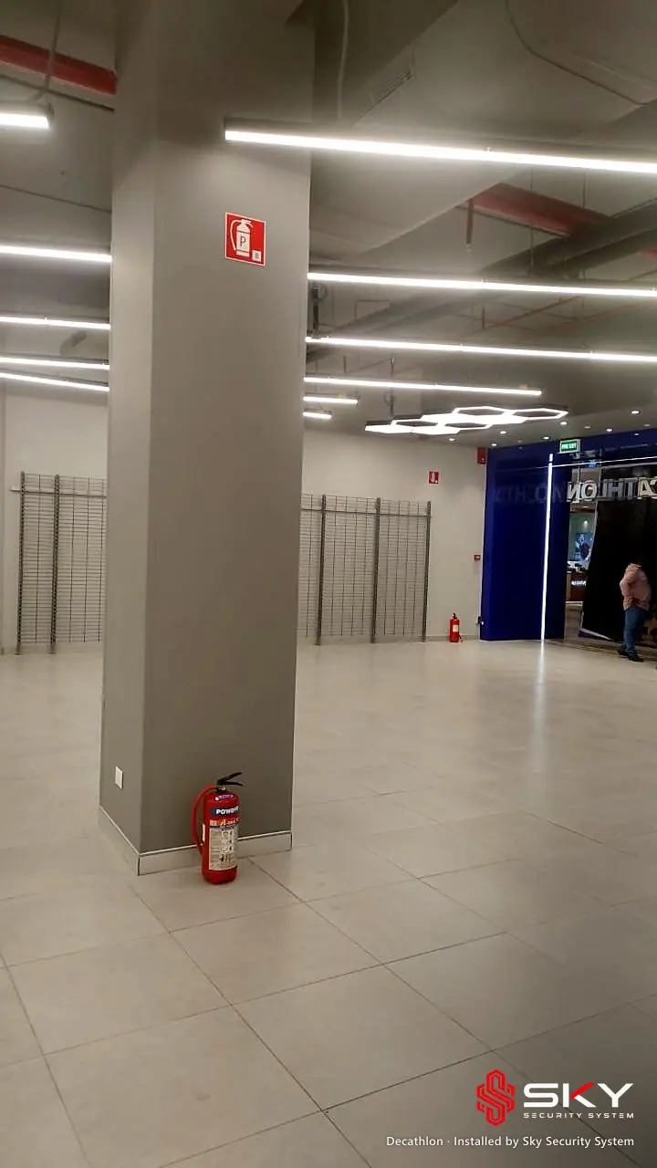 Pillar with fire extinguisher at the Decathlon site. Security and ELV work by Sky Security System.