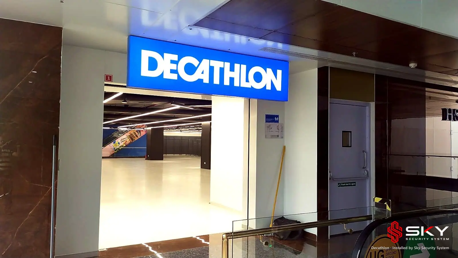 Store entrance with the Decathlon sign at the Decathlon site. Security and ELV work by Sky Security System.