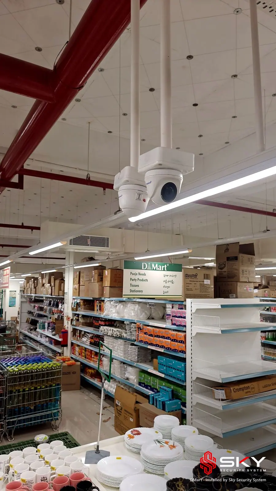 Ceiling camera over the shop floor at the DMart site. Security and ELV work by Sky Security System.