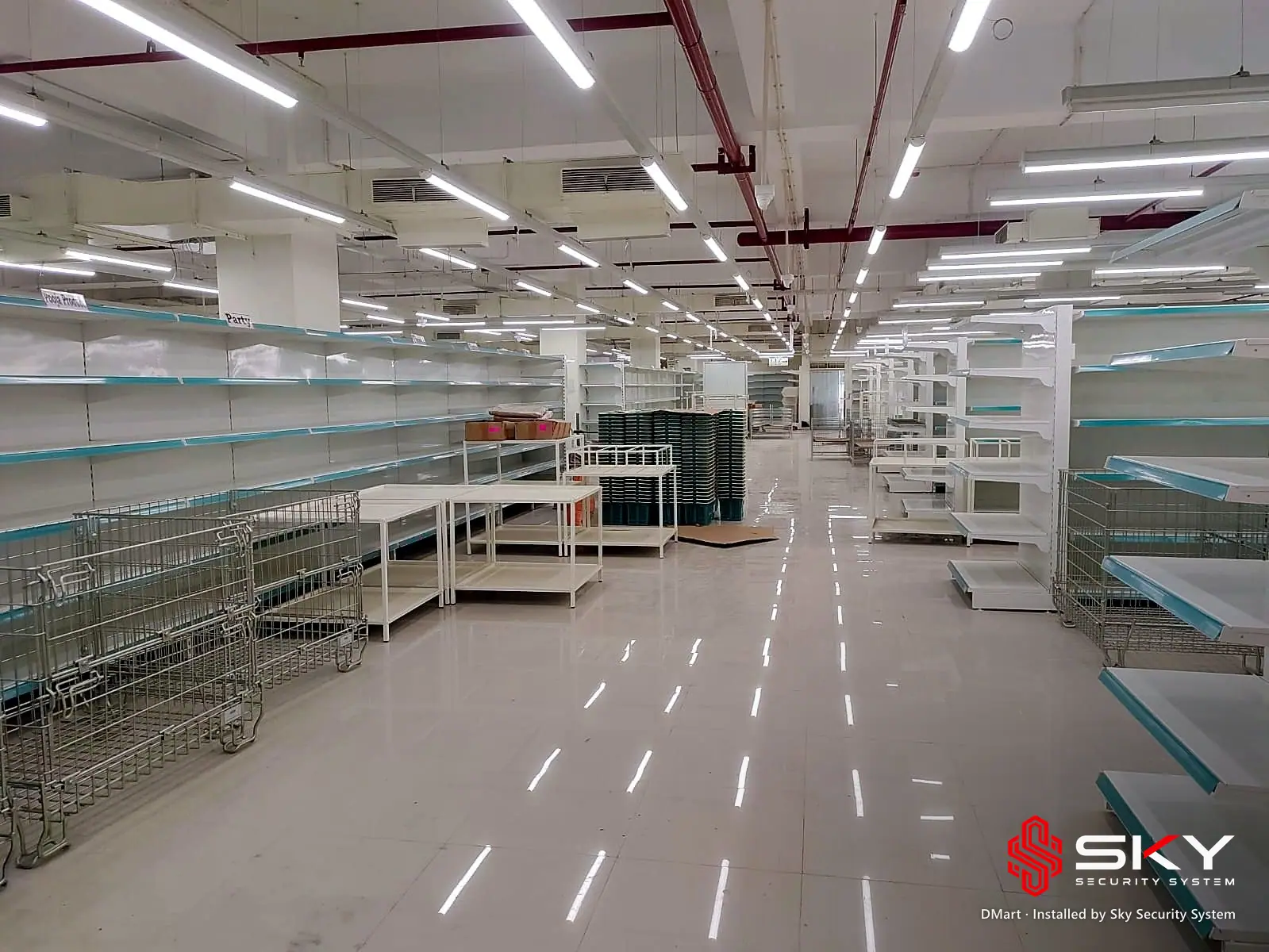 Store floor during fit-out at the DMart site. Security and ELV work by Sky Security System.