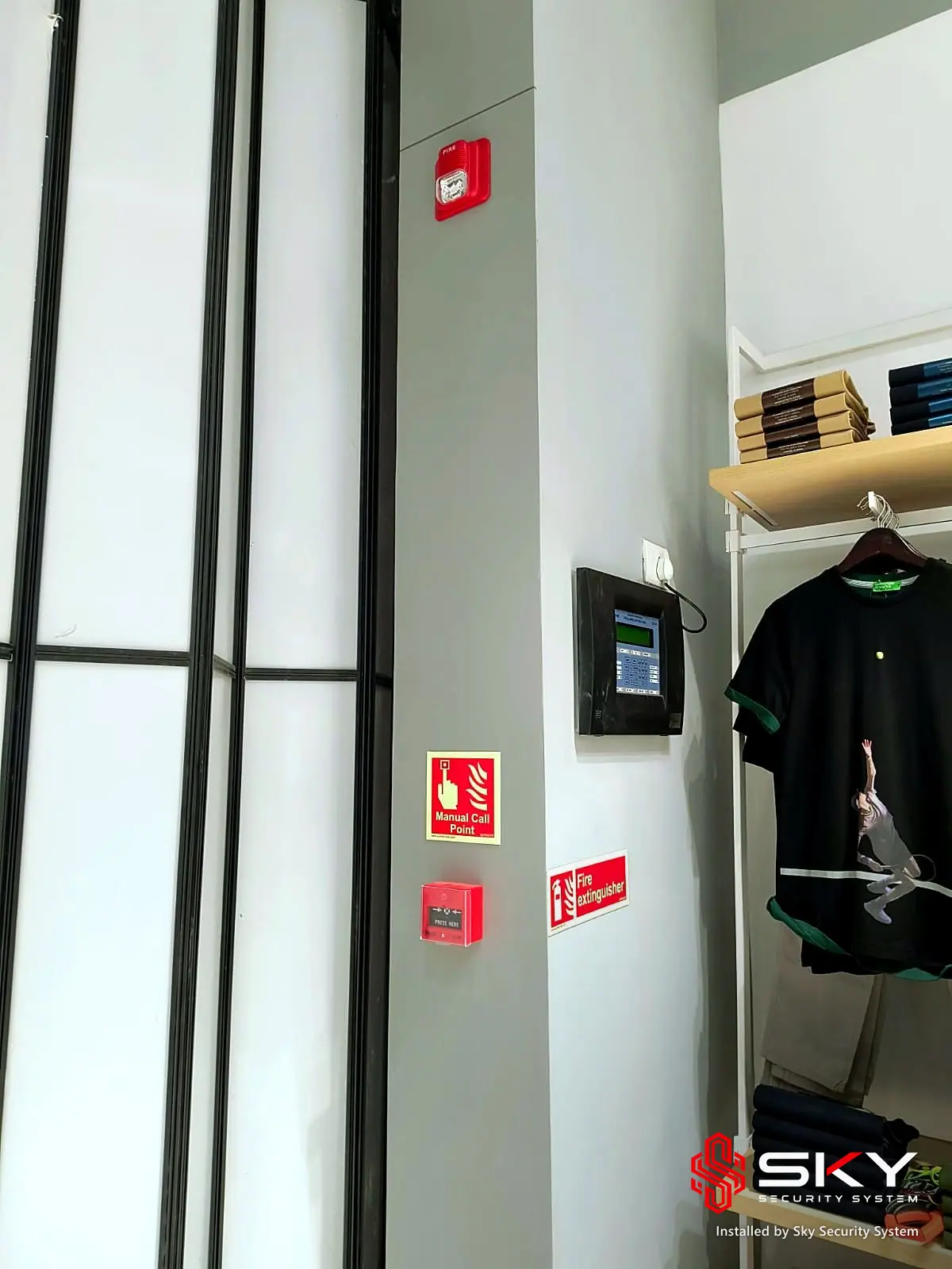 Wall-mounted panel in the store at a fashion retail. Security and ELV work by Sky Security System.
