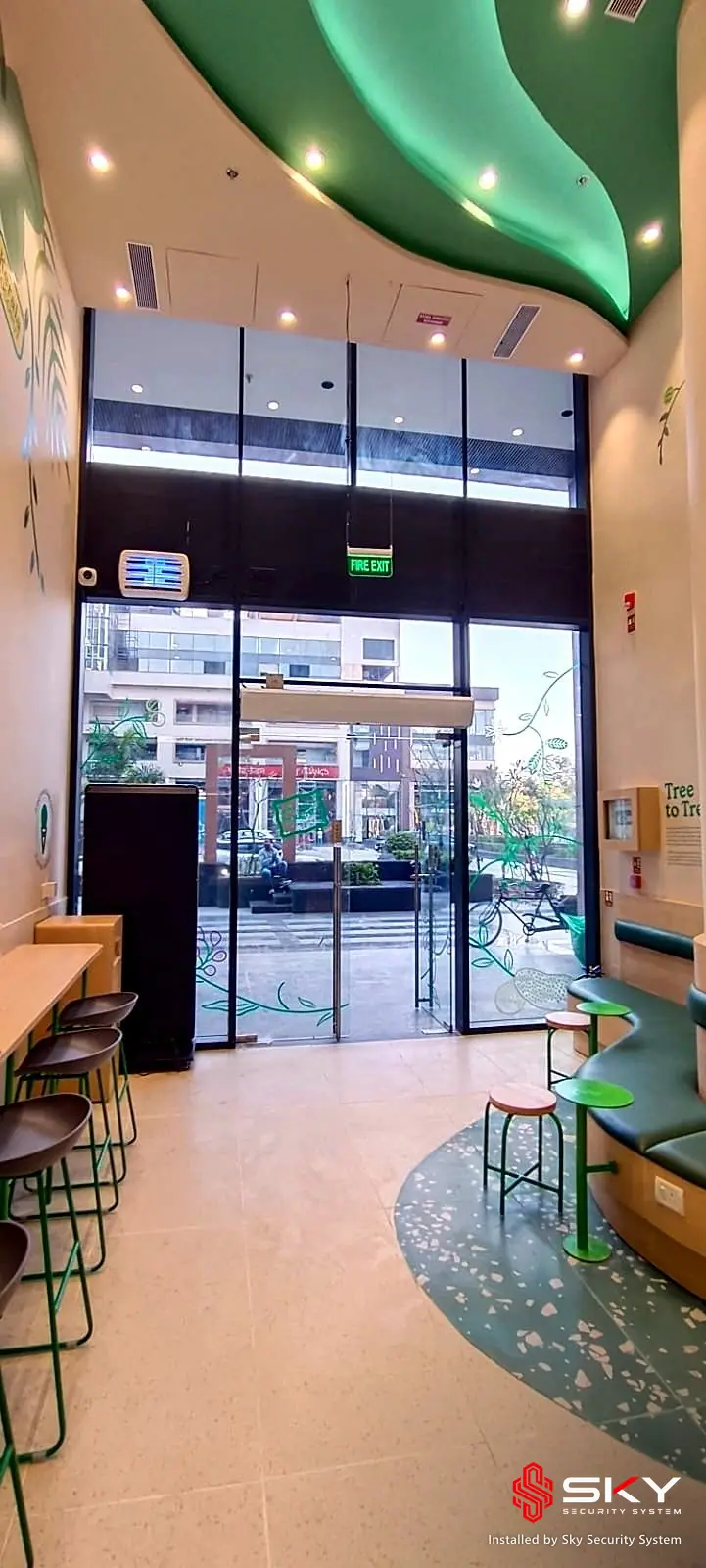 Entrance and seating at a food retail. Security and ELV work by Sky Security System.