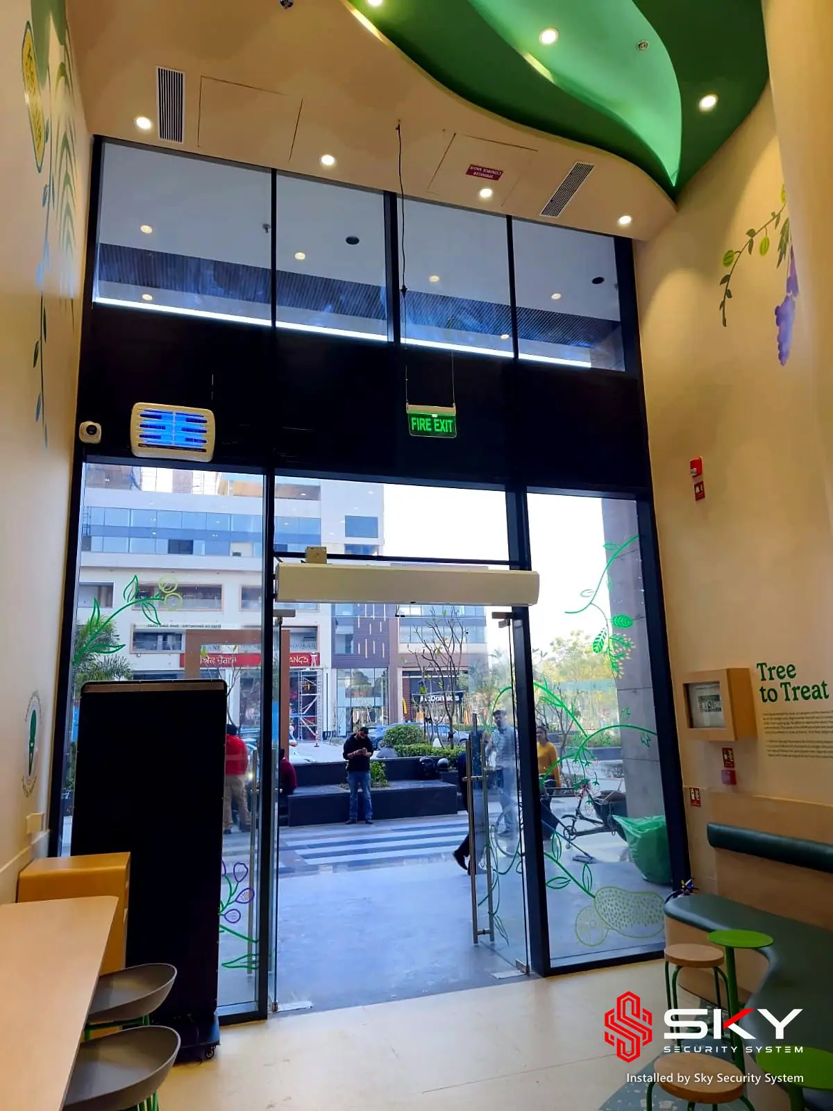 Glass entrance at a food retail. Security and ELV work by Sky Security System.