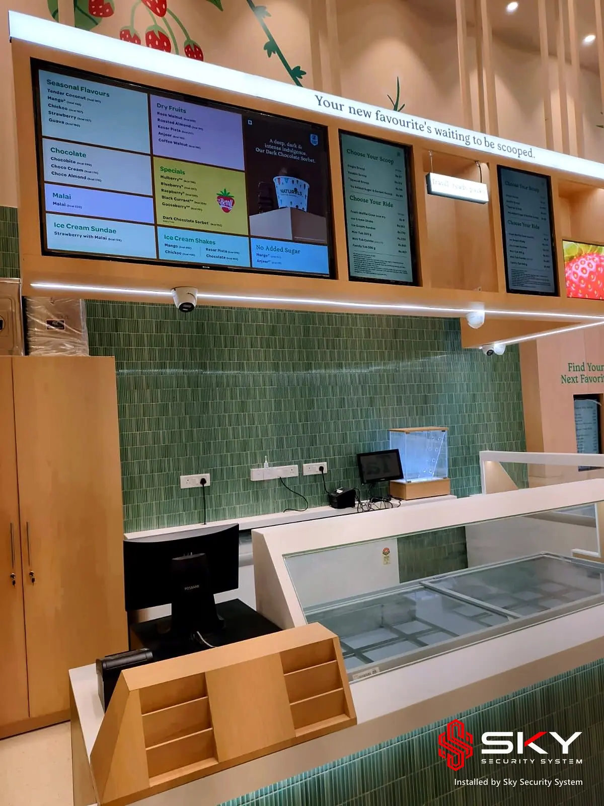Menu boards and billing counter at a food retail. Security and ELV work by Sky Security System.