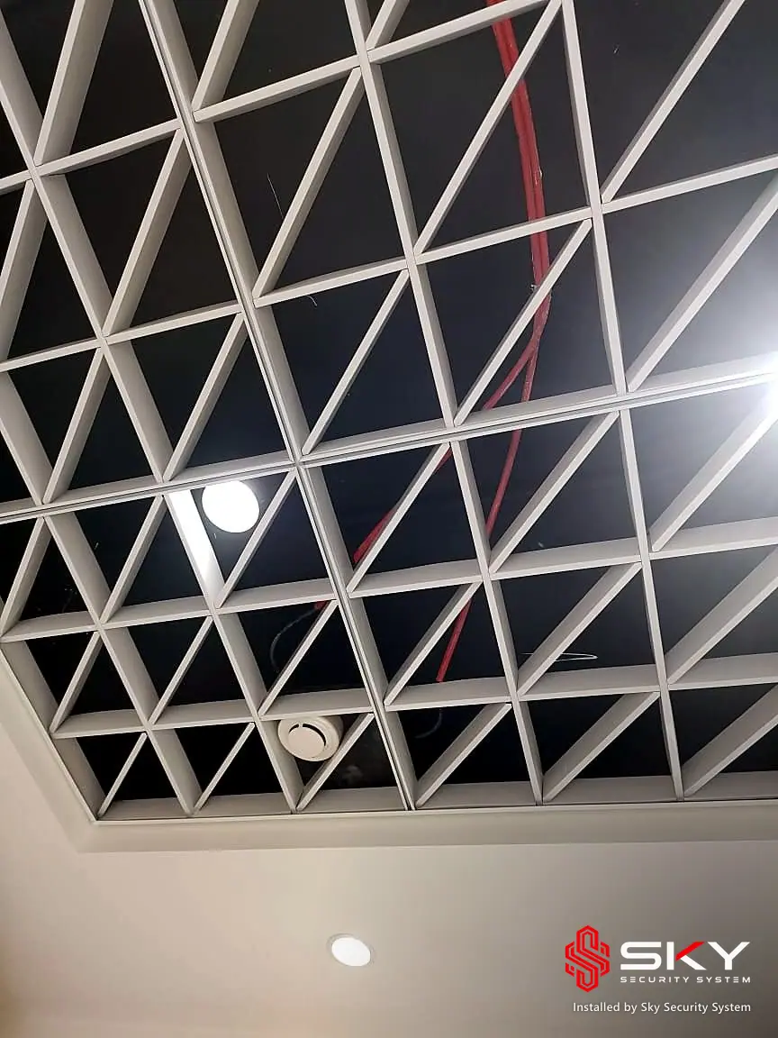 Geometric ceiling at a corporate office. Security and ELV work by Sky Security System.