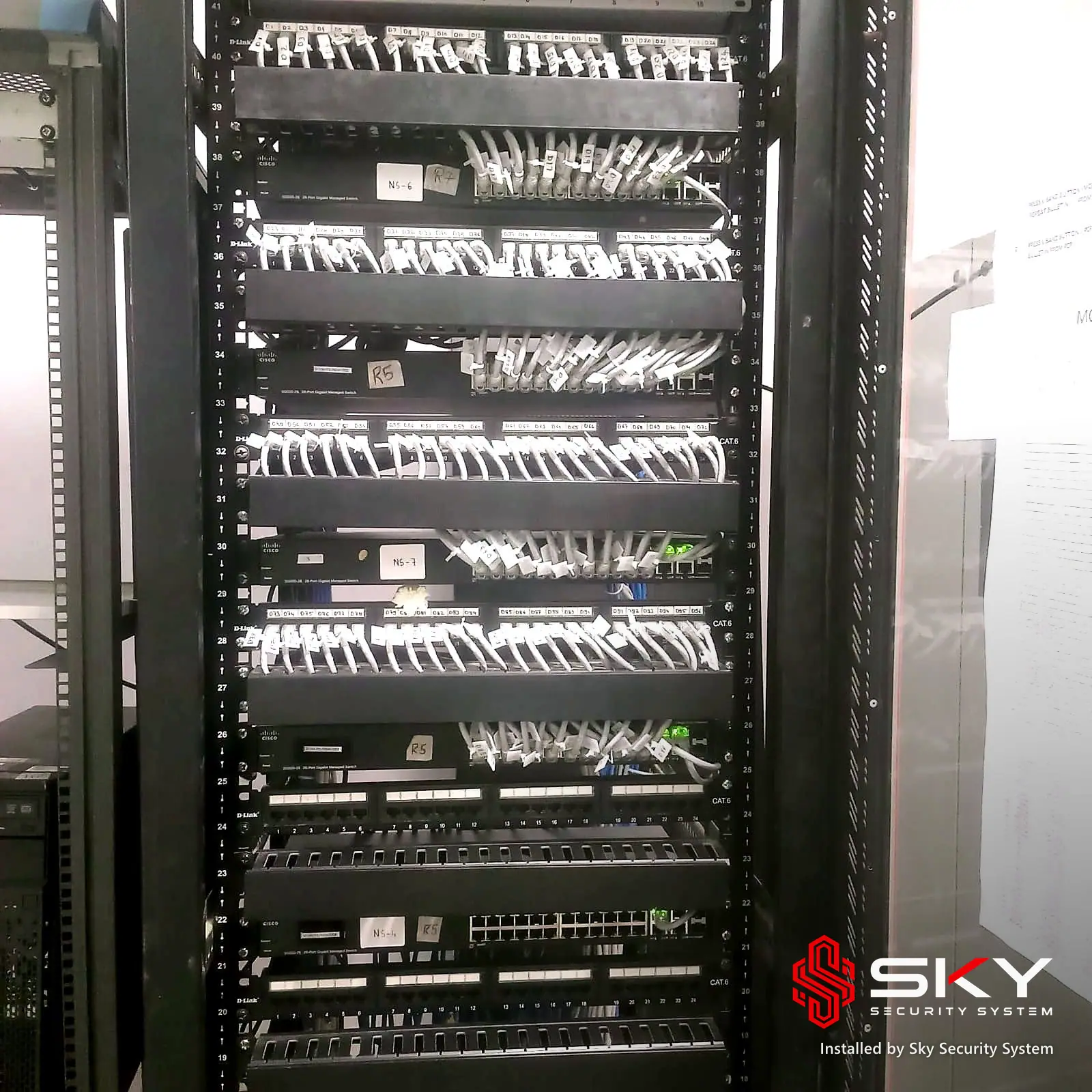 Floor-standing network rack at an it office and warehouse. Security and ELV work by Sky Security System.