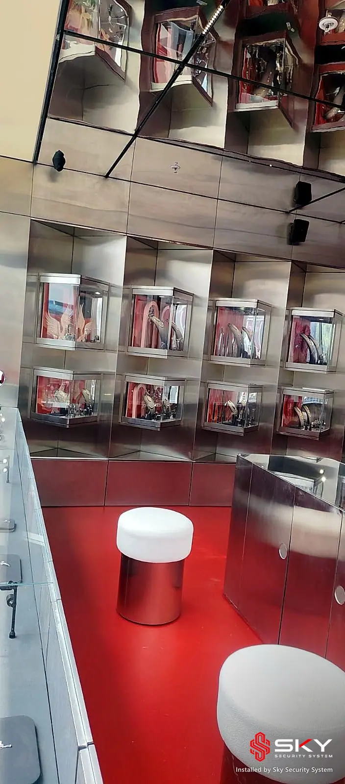 Display wall at a luxury retail. Security and ELV work by Sky Security System.