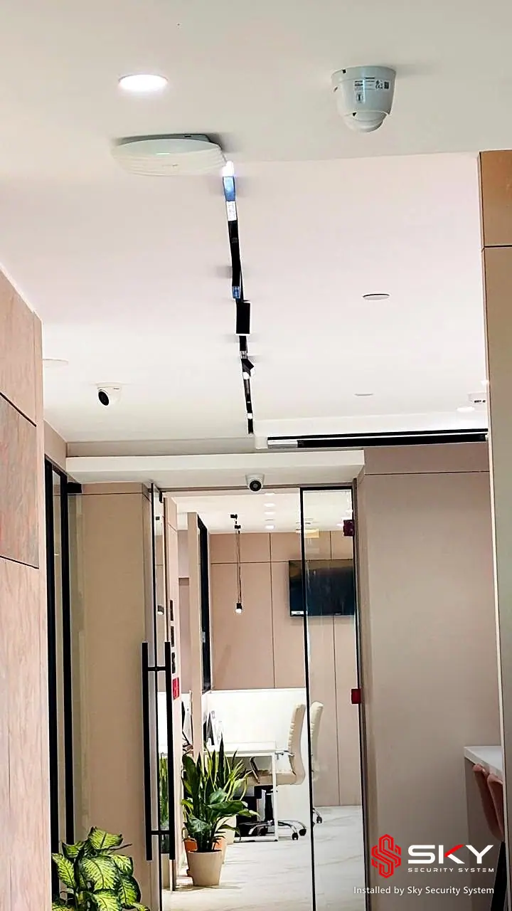 Corridor with ceiling devices at a corporate office. Security and ELV work by Sky Security System.