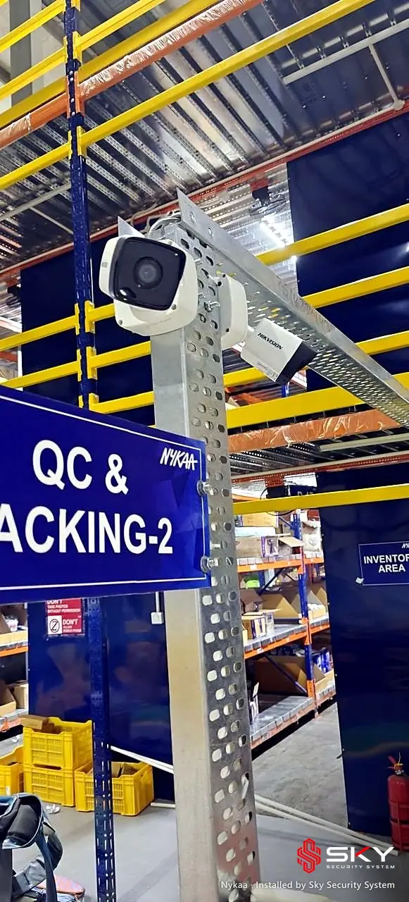 Bullet camera above the QC and packing area at the Nykaa site. Security and ELV work by Sky Security System.