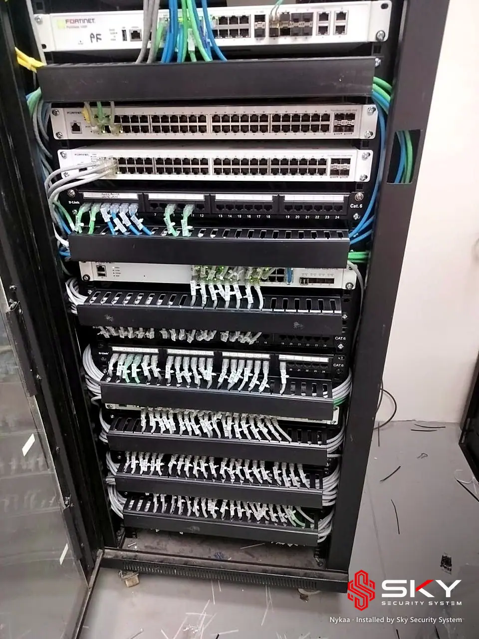 Floor-standing network rack at the Nykaa site. Security and ELV work by Sky Security System.