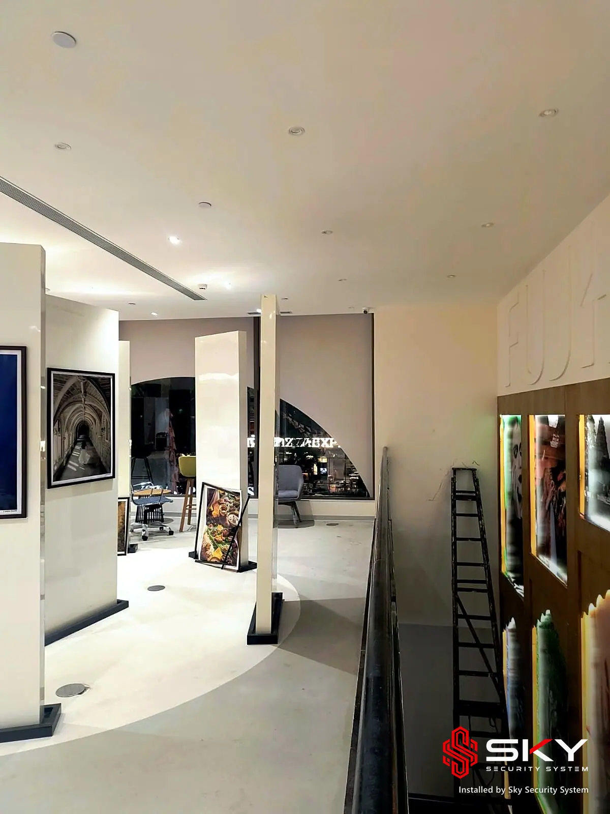 Gallery corridor at a retail experience centre. Security and ELV work by Sky Security System.