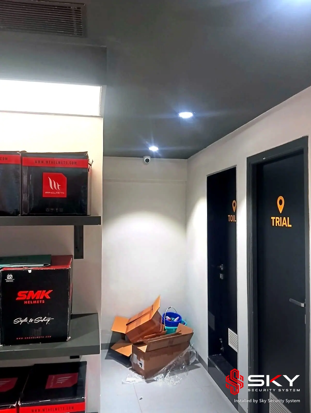 Trial room corridor with a ceiling camera at an automotive retail. Security and ELV work by Sky Security System.