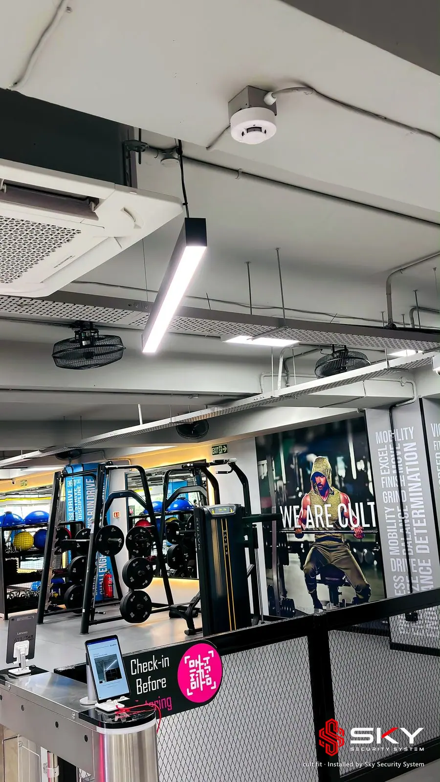Gym floor with ceiling devices at the cult.fit site. Security and ELV work by Sky Security System.