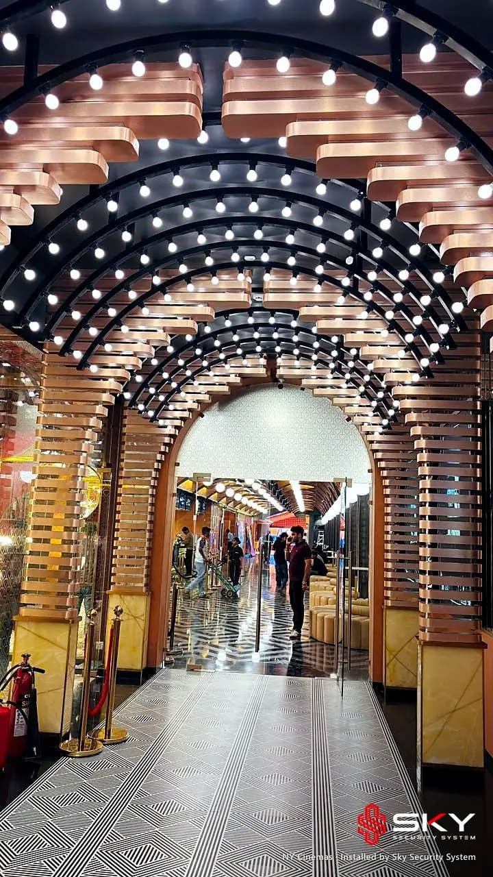 Illuminated arch corridor at the NY Cinemas site, Thane. Security and ELV work by Sky Security System.