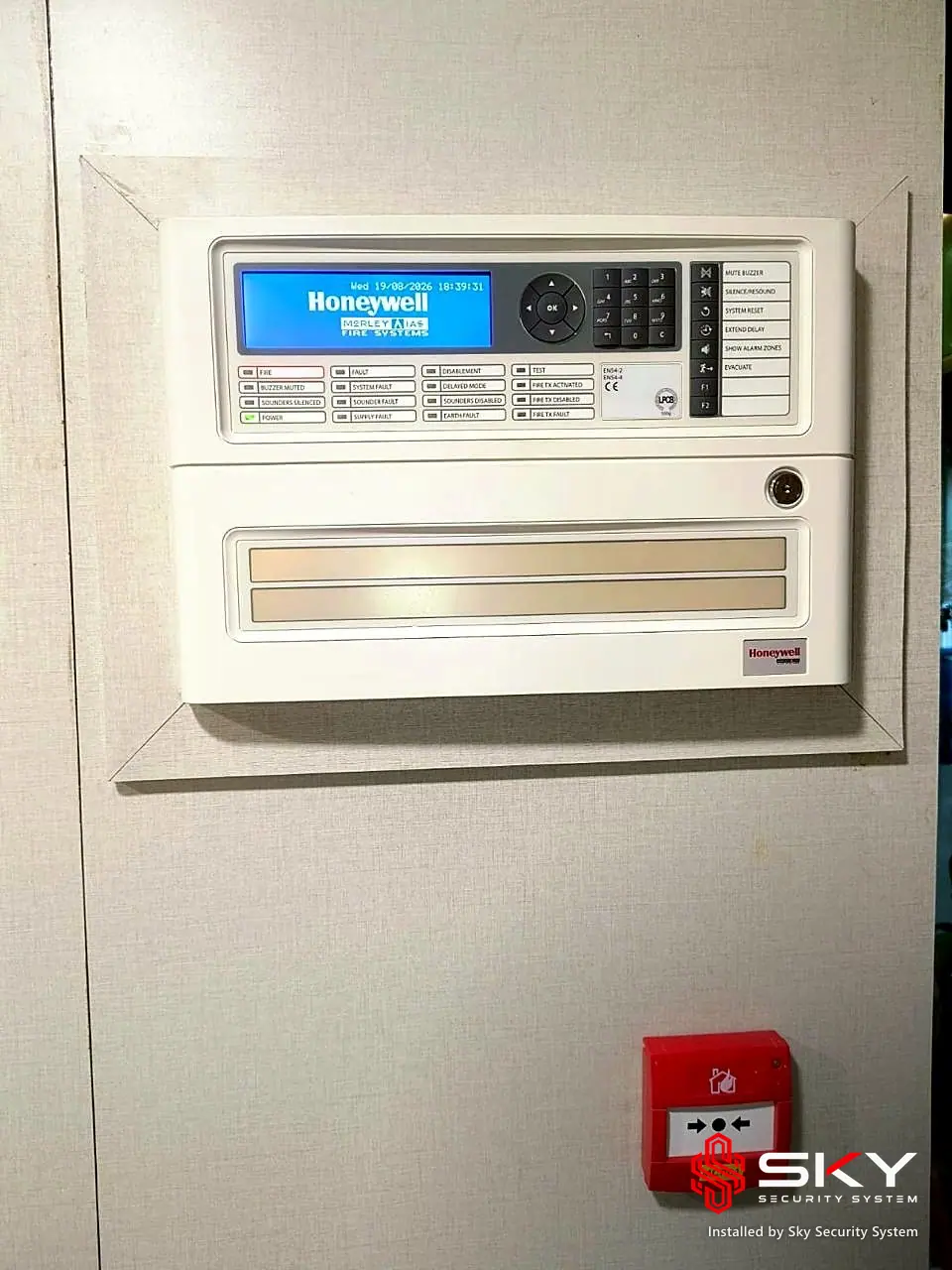 Fire alarm control panel and call point at a pharma. Security and ELV work by Sky Security System.
